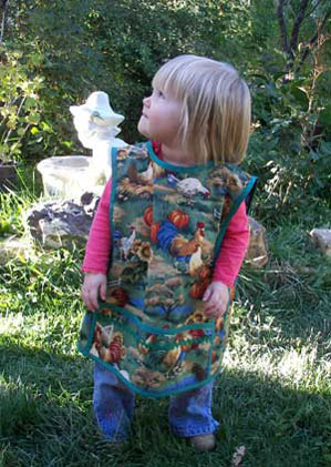 Child apron in chicken garden